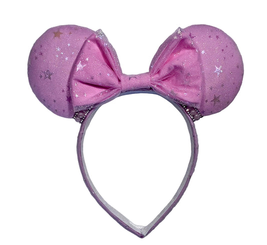Handmade and ready to ship Pink Sparkling Iridescent fabric on pink to make mouse ears with the fabric on both the front and back along with the headband the is universal sized and fits most. The set has a matching bow, but you can request any sequin color in your order and I'll attach it. Item is shown on a white background.