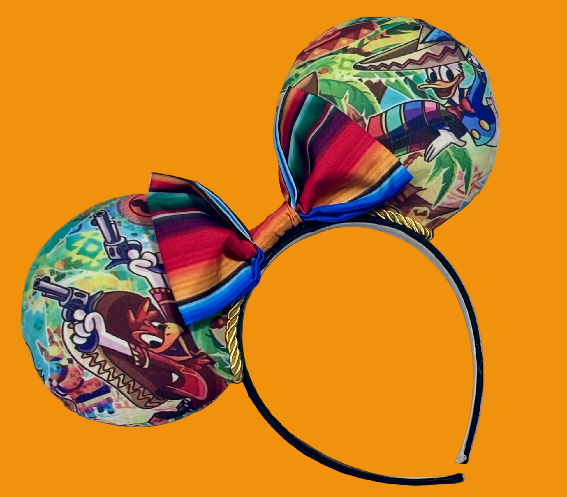 Colorful Handmade and ready to ship mouse ears with a colorful bow on an orange background with duck cartoon images on the ears front and back with Handmade and ready to ship. yellow twisted trim and on a black poly universal sized headband
