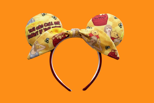 Handmade and ready to ship Twisted bow Honey Mouse ears with TS and Pooh on the fabric front and back and the bow as well. The headband has red plush fabric and is a universal sized headband.