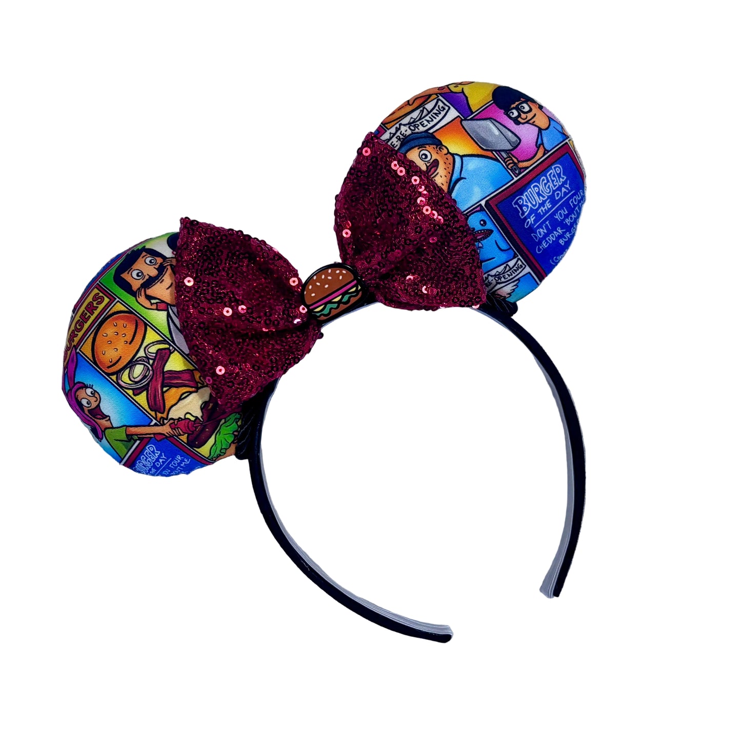 Handmade and ready to ship Belcher and friends mouse ears with the fabric on both the front and back. The headband is black universal sized and fits most. The set has a red sequin bow with a burger embellishment on the middle. Item is shown on a white background.
