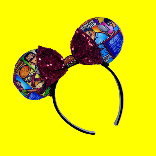 Handmade and ready to ship Belcher and friends mouse ears with the fabric on both the front and back. The headband is black universal sized and fits most. The set has a red sequin bow with a burger embellishment on the middle. 