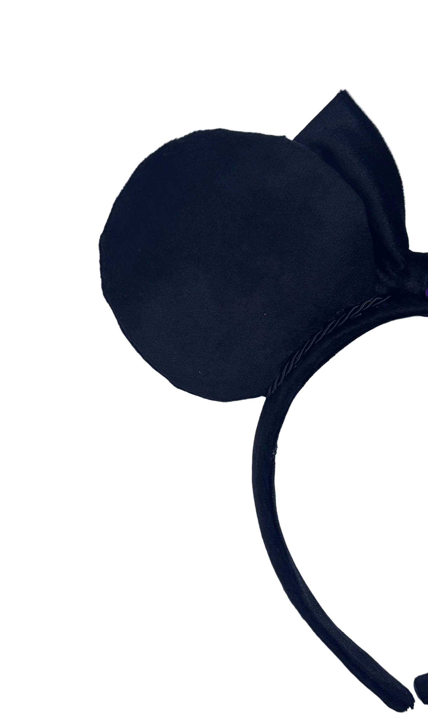Black mouse ear headband on a textured gray background