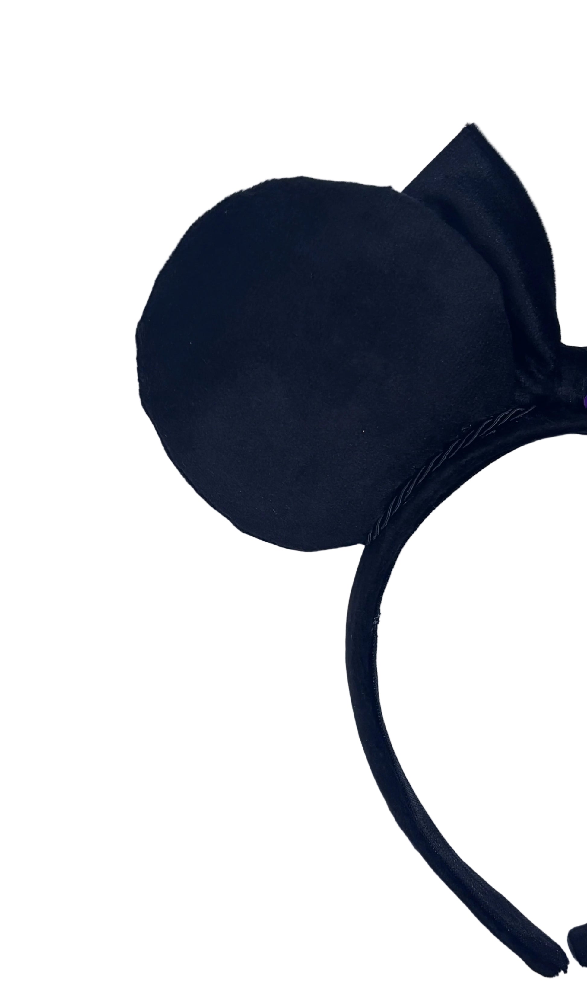 Black mouse ear headband on a textured gray background
