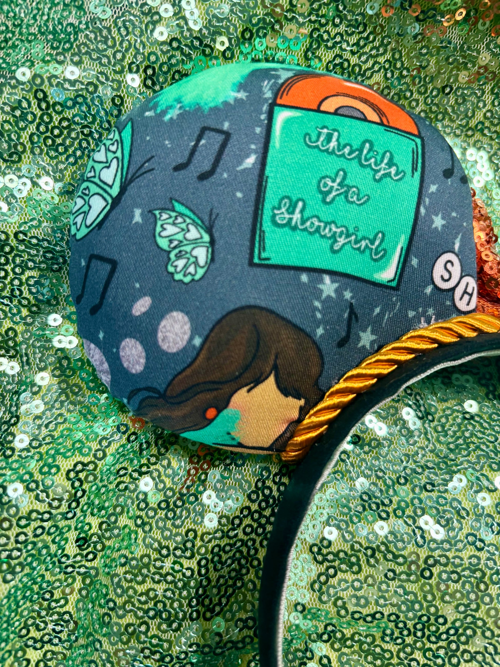 back side of mouse ears showing the life of a showgirl. Handmade and ready to ship. 