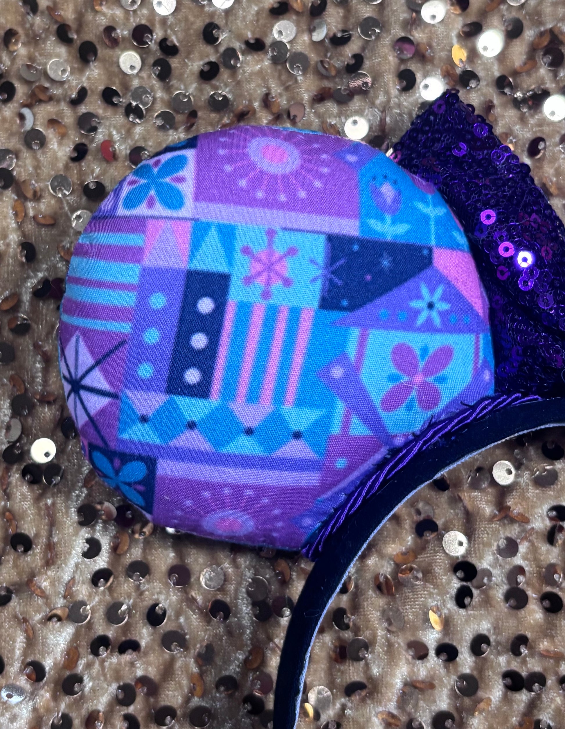 Colorful geometric-patterned object on a textured background