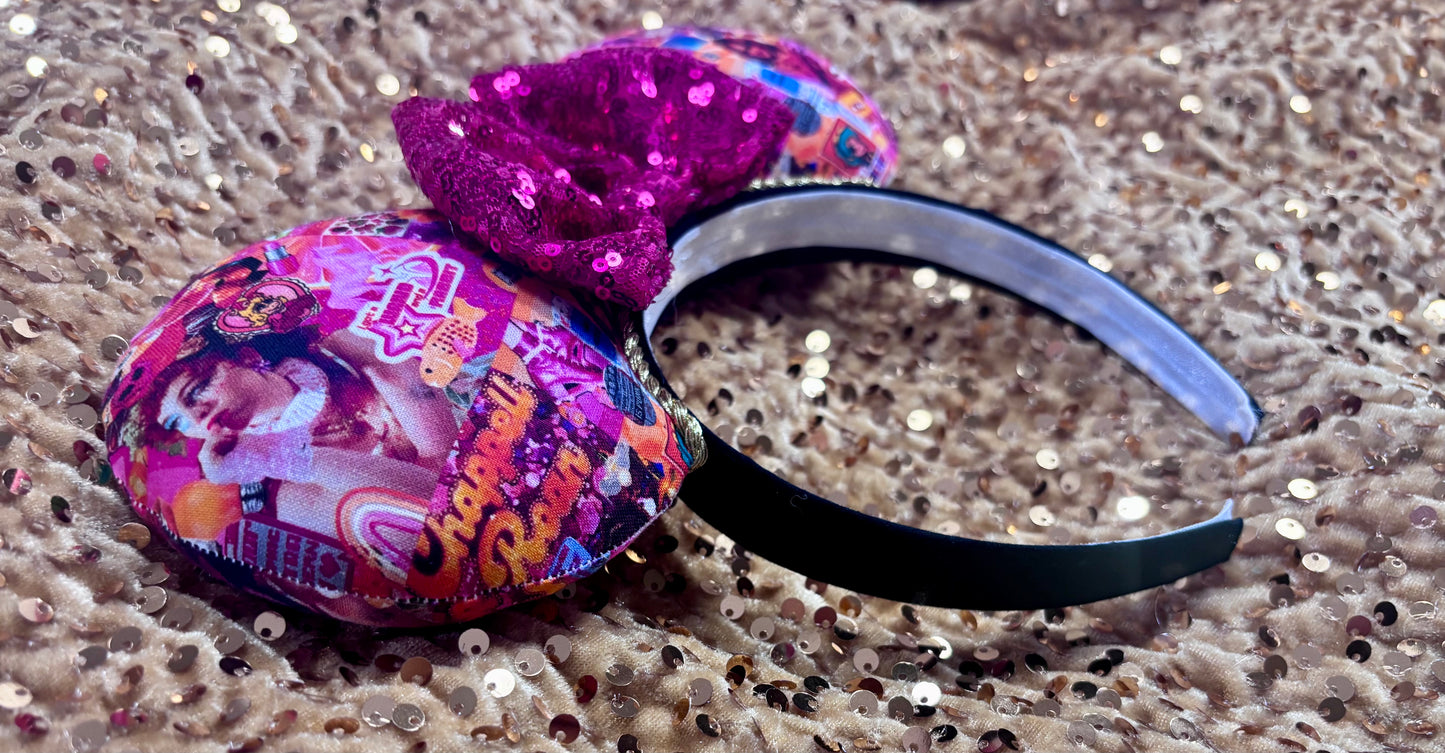 Handmade and ready to ship Colorful Chappell inspired Mouse ears with a hot pink bow on a headband against a gold sequin background.