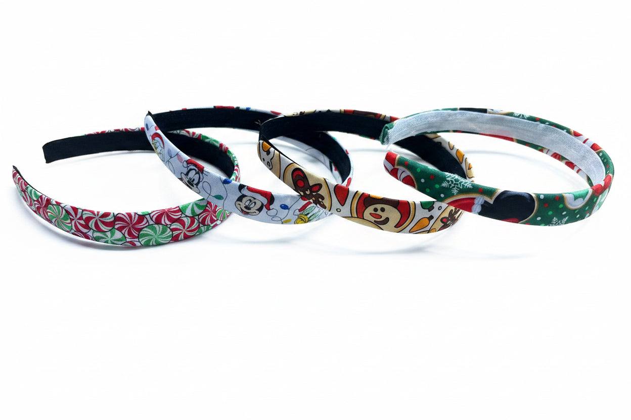 Set of four colorful headbands with festive patterns on a white background