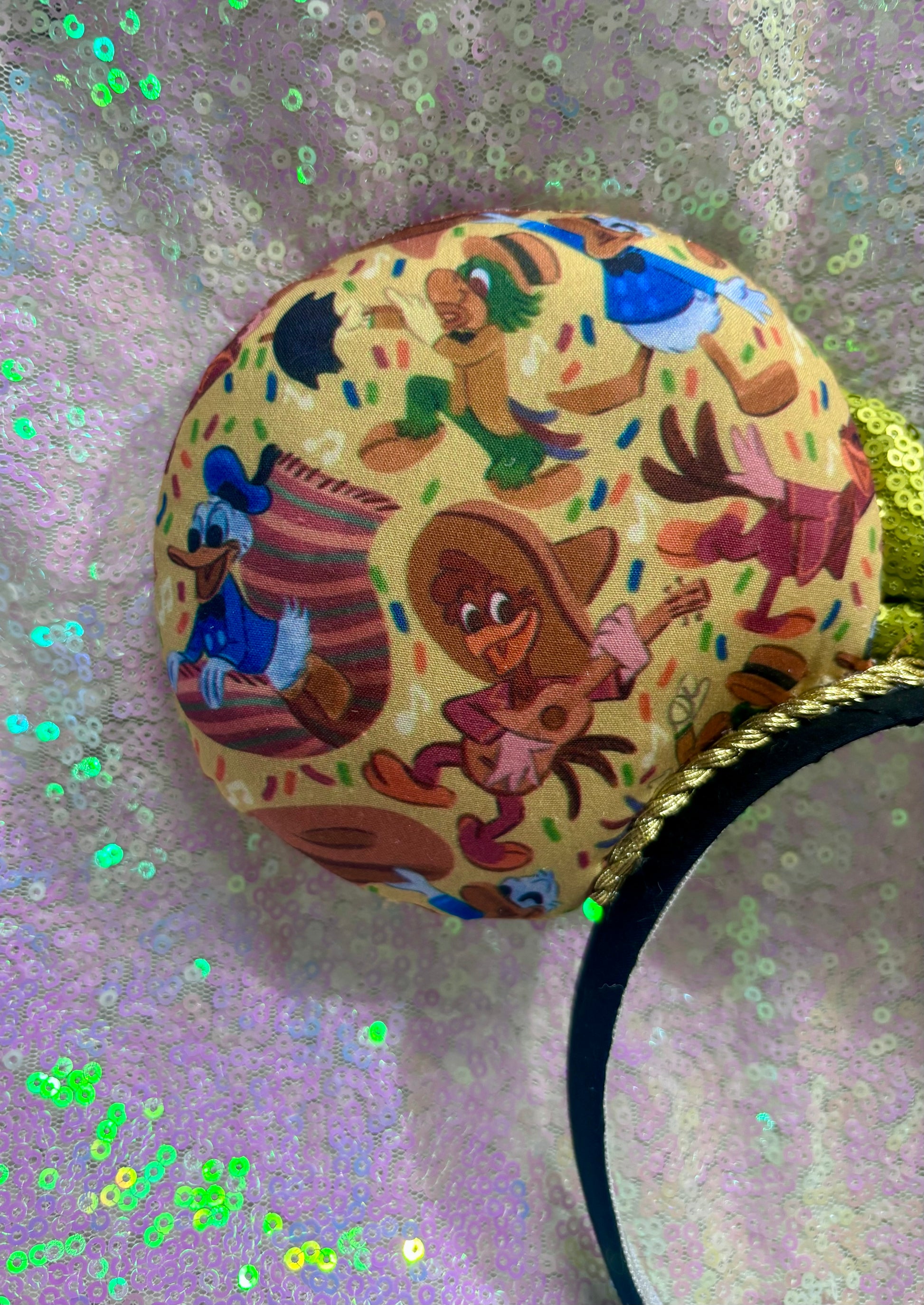 Handmade and ready to ship. These are perfect for Epcot. Three Caballero themed with a lime green sequin bow on a headband making mouse ears. Shown on a white background. Back left side of mouse ear is shown.