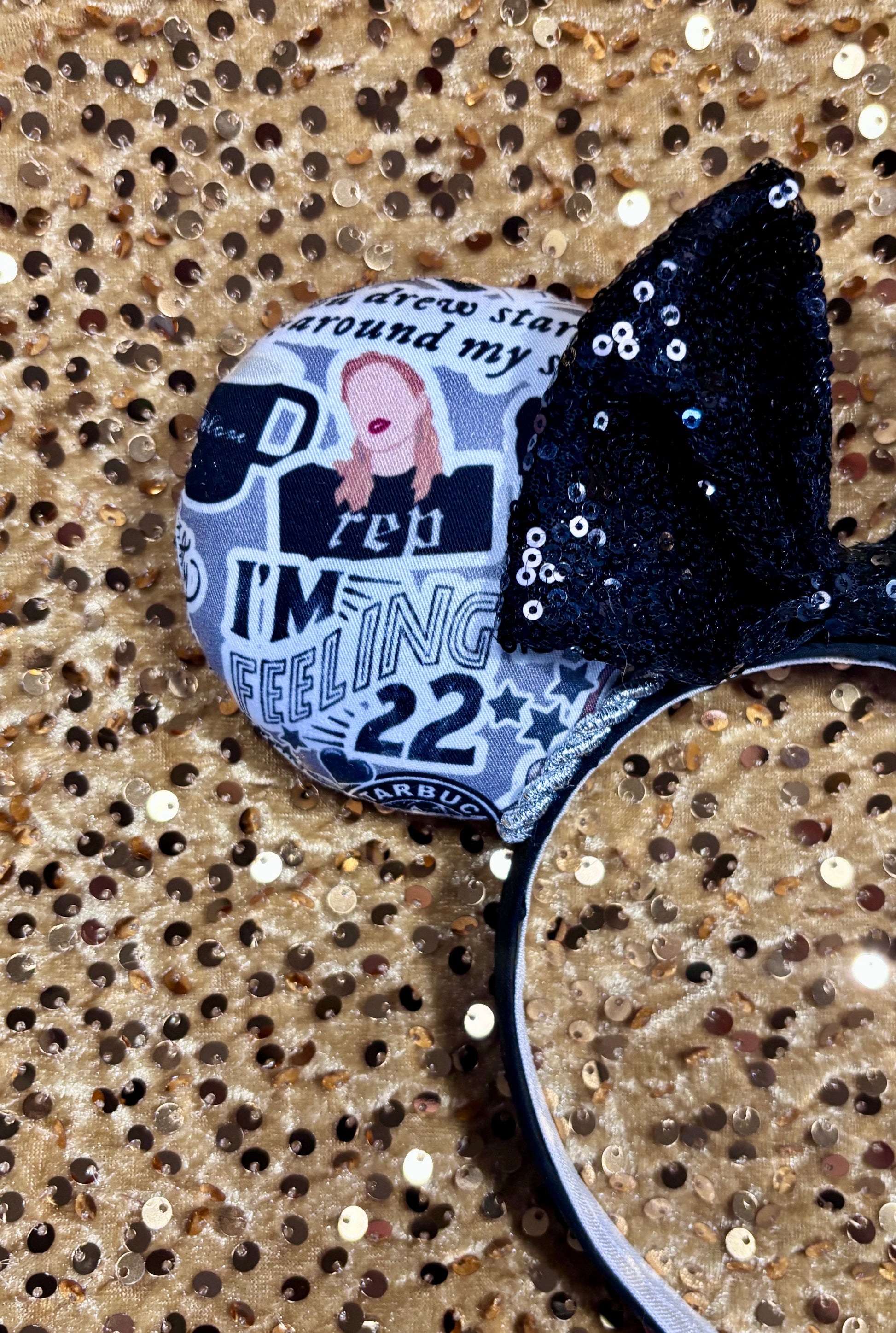 Handmade and ready to ship Mouse Ears with Black and White Swiftie sayings and pictures. has a black sequin bow.