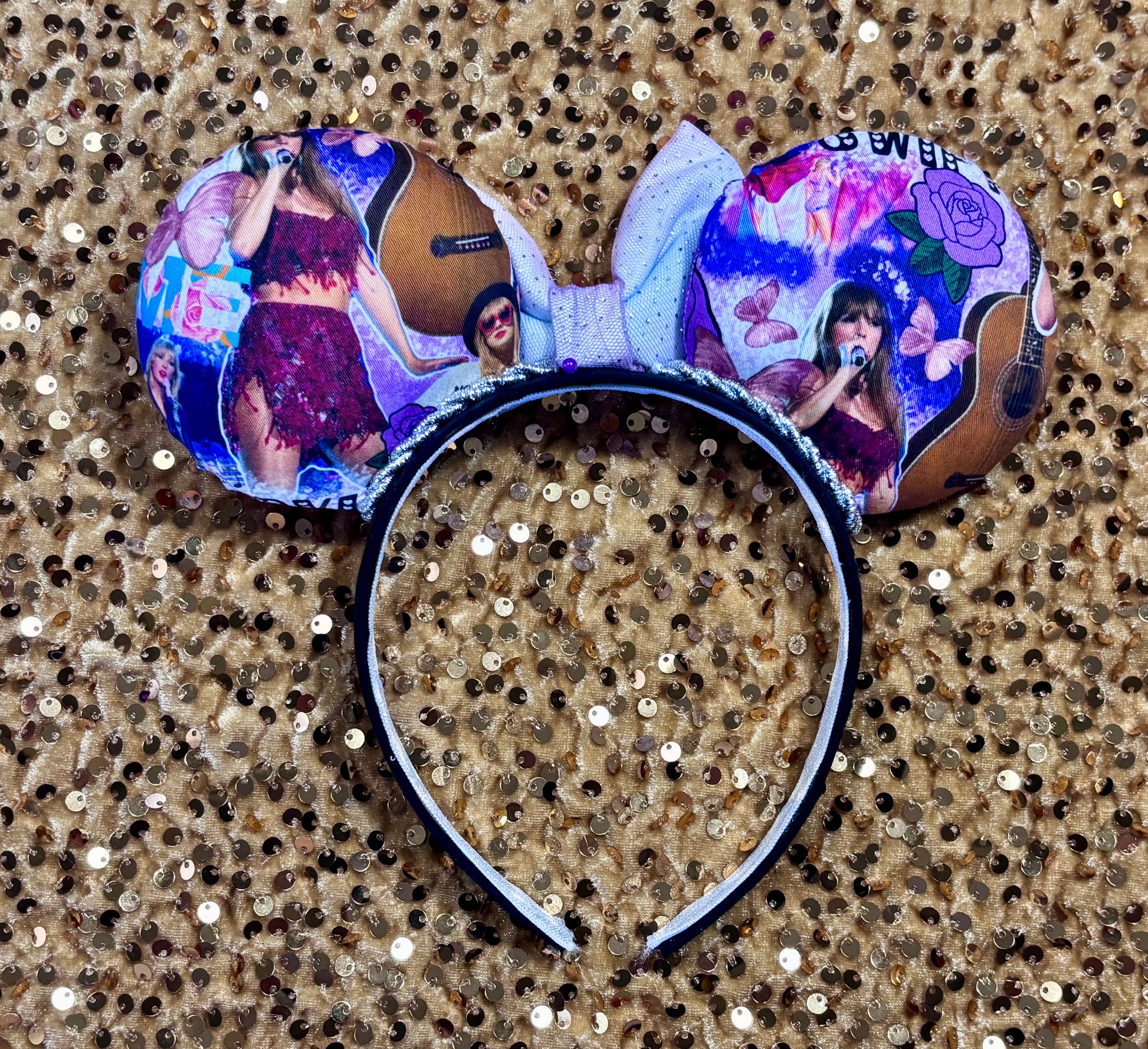Back view of mouse ears. Handmade and ready to ship TS Mouse ears with a new beautiful sewn tulle bow with sparkles on it. Of course, you can still request any bow in sequin if you prefer and I will attach it. Shown on a gold sequin background.