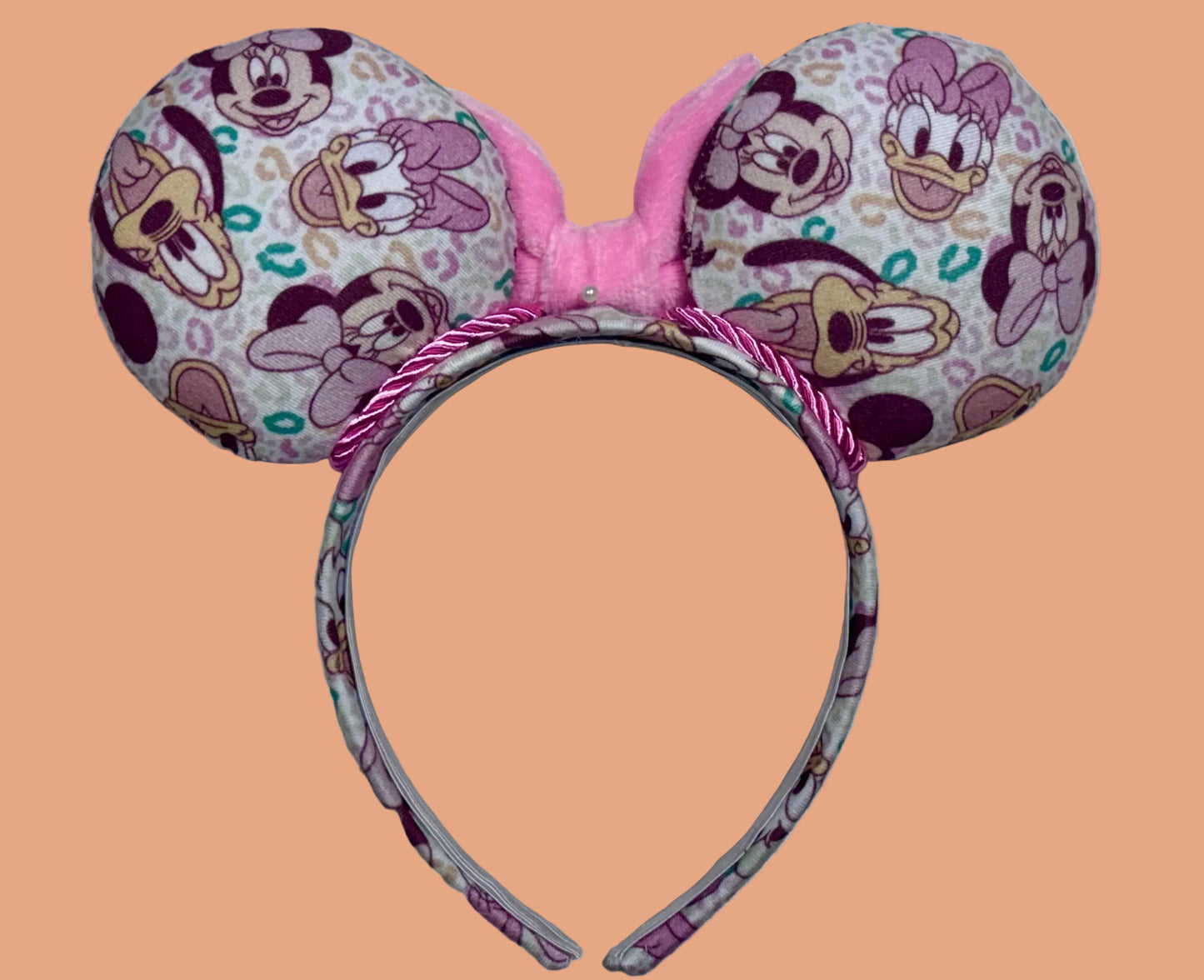 Handmade and ready to ship Leopard Mouse ears headband with a pink plush bow on a universal sized matching headband. Back view.