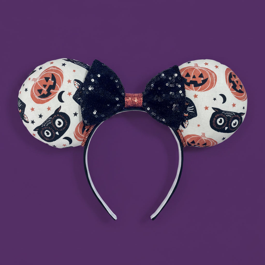 Handmade and ready to ship. Mouse ears with vintage cats, owls, and pumpkin mouse ears are on the front and back of mouse ears with a black sequin with orange middle bow.