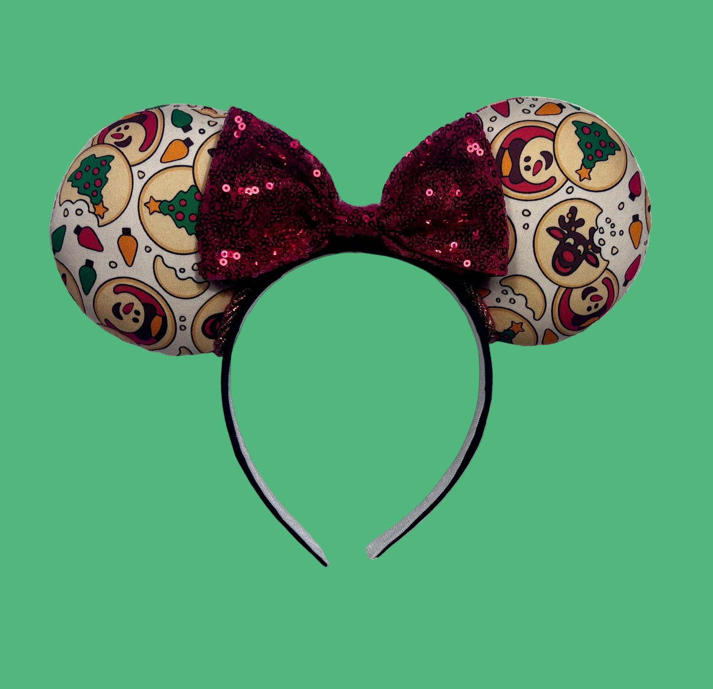 Handmade and ready to ship Christmas Sugar Cookie mouse ears with the fabric on both the front and back. The headband is black universal sized and fits most. The set has a red sequin bow. 