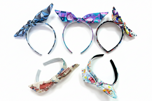 Handmade and ready to ship twisted bow headbands. This set of 5 colorful headbands come with sets in EPCOT, SMALL WORLD, PARK COLLAGE, MK RIDES AND THEM PARK. Made on universal headbands that fit most. 