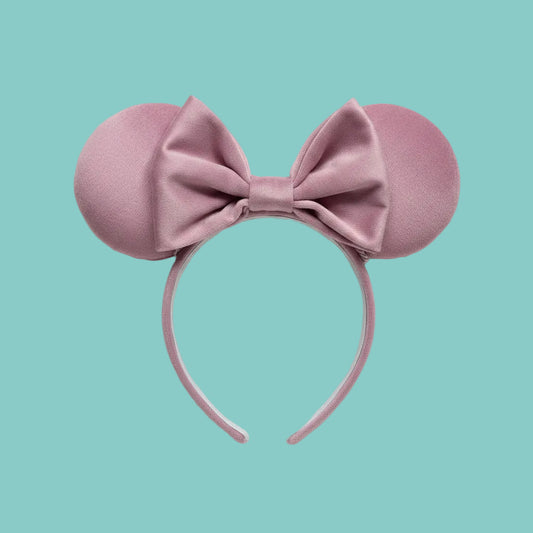 Handmade and ready to ship. Soft Velvety dusty pink Mouse ears with a soft matching bow with pink twisted trim on a universal sized matching headband. 
