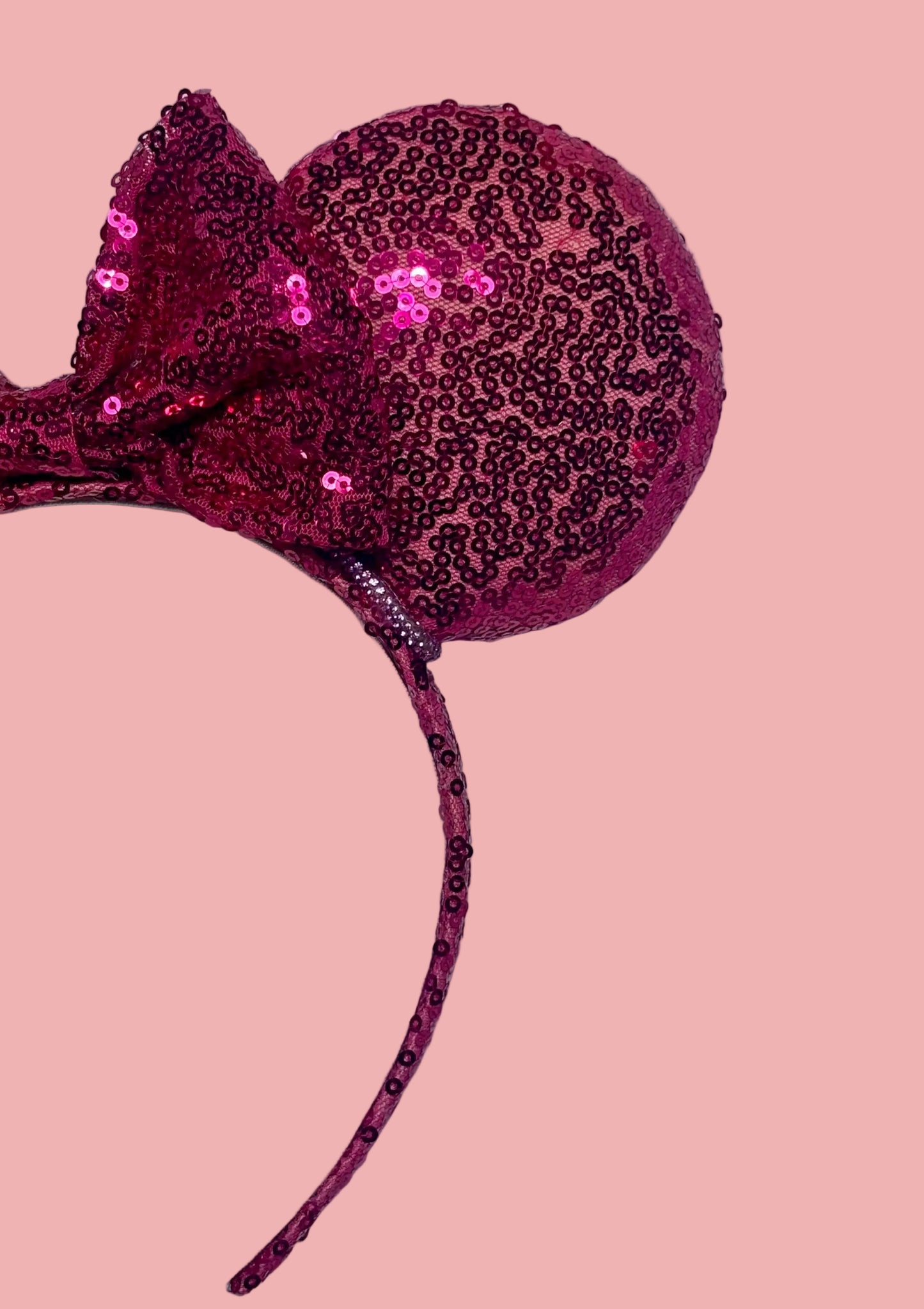 close up of other front side of headband. Handmade and ready to ship, Hot Pink Custom Ears. Fabric is on ears front and back with pink rhinestone trim along the inner ears and a matching hot pink sequin bow. The Headband is universal sized and has the same hot pink sequin fabric.