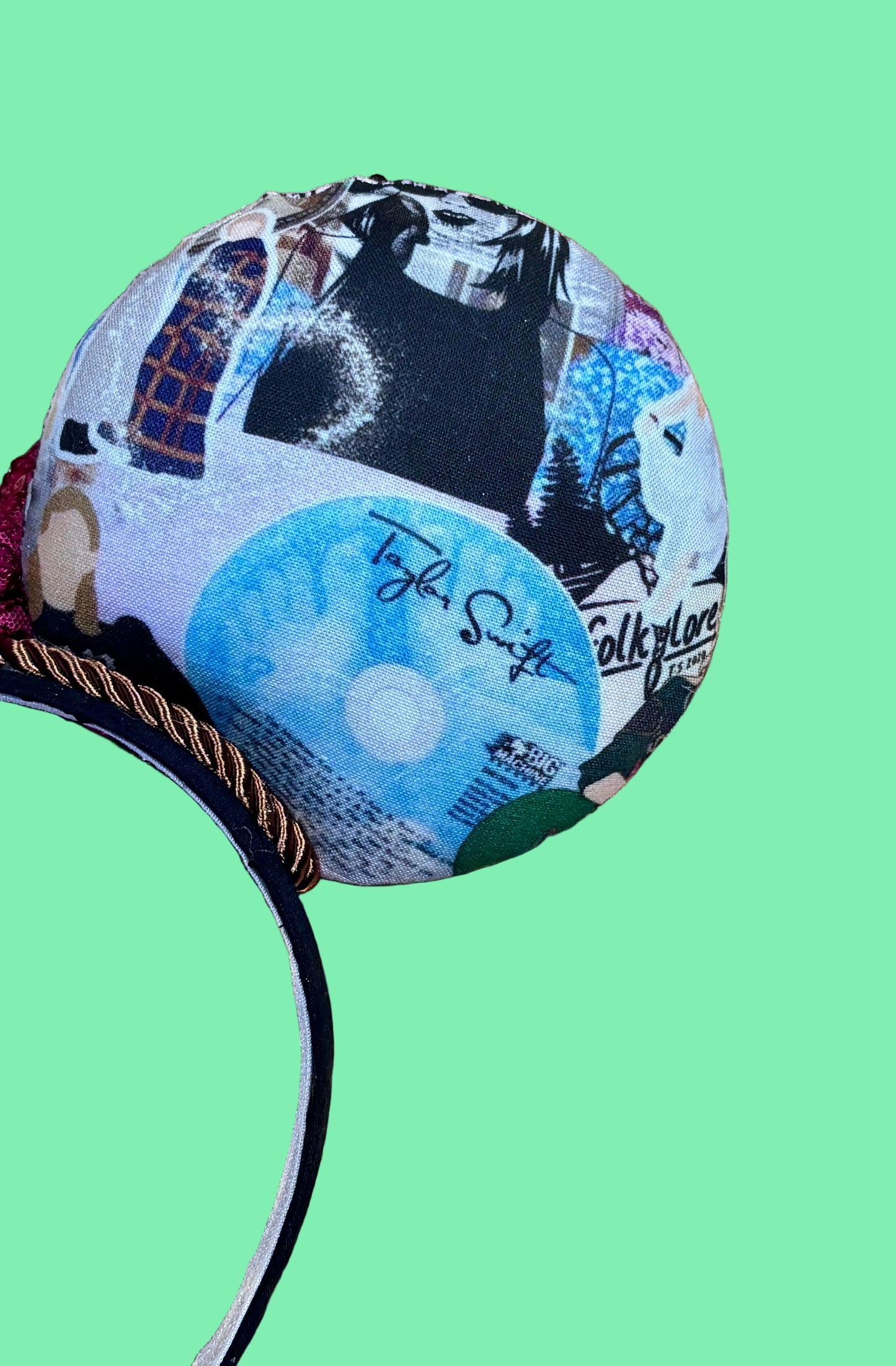Mouse ears with Tay collage pictures with a pink bow and collage design. Back right side of the ear view in photo.