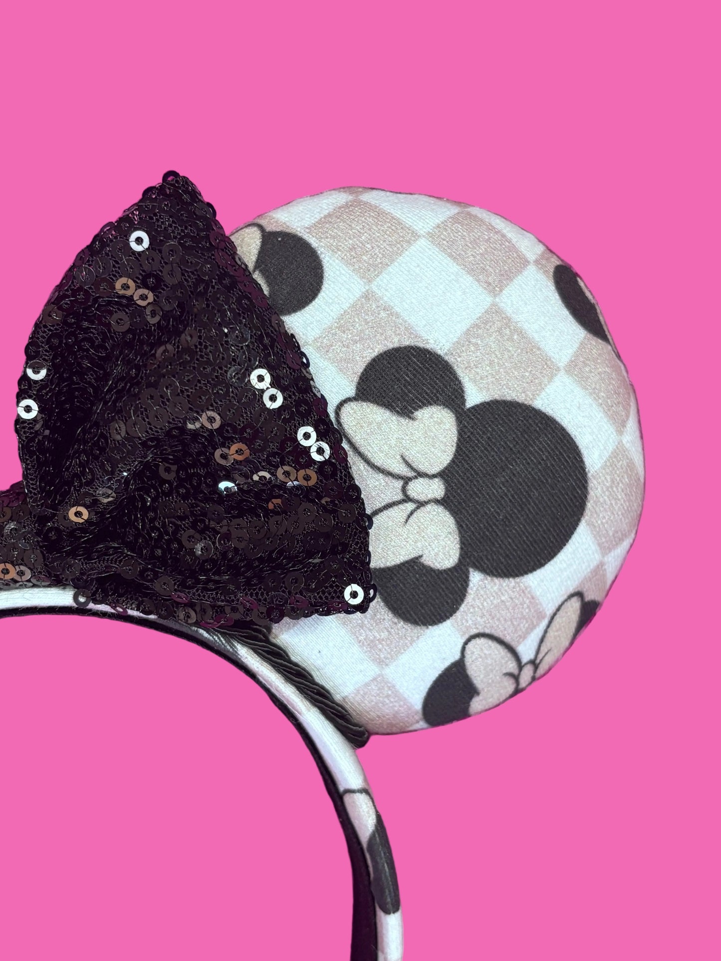 Close up of the other mouse ear. Handmade and ready to ship Checkered Mouse ears with famous Minnie ear bows on the design and a black sequin bow with black twisted trim on a universal sized headband.