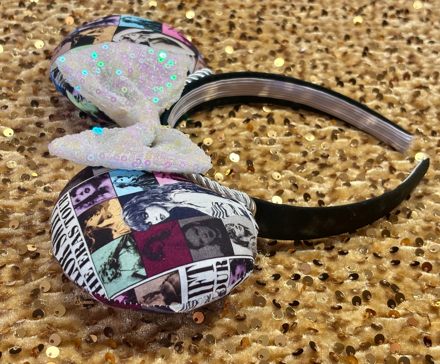 Eras Mashup Mouse Ear headband with white iridescent sequin bow. You can request any color sequin bow in your order by leaving a note. Handmade and ready to ship with fabric on both the front and the back of mouse ears. The set has a silver twisted trim along the inner ears. Ears are on a black poly cotton universal sized headband. Other side view of headband.
