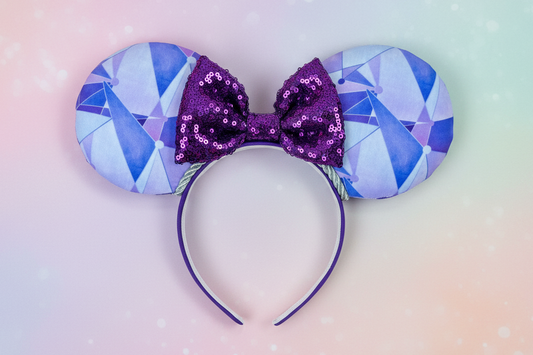 The purple wall themed Mouse ears with a purple sequin bow and twisted trim. Shown on a pastel background