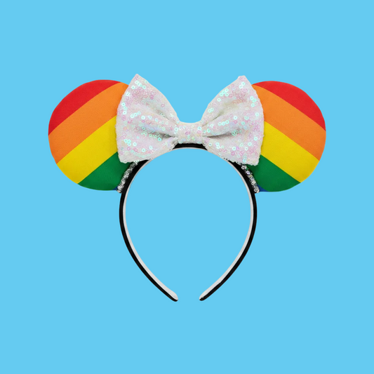 Handmade and ready to ship Pride Mouse ears with a white iridescent sequin bow with silver twisted trim and on a black universal sized headband.