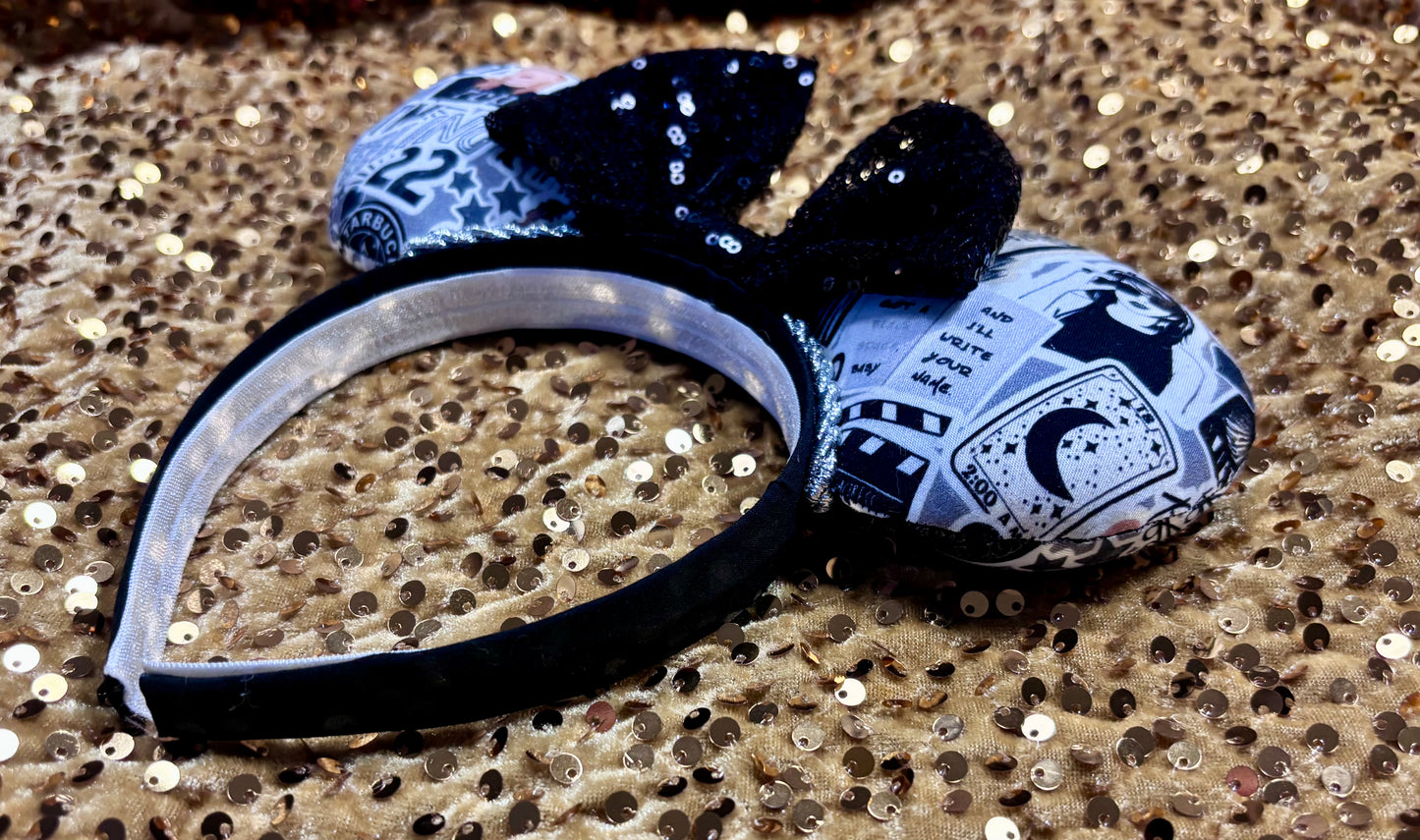 Handmade and ready to ship Mouse Ears with Black and White Swiftie sayings and pictures. has a black sequin bow.