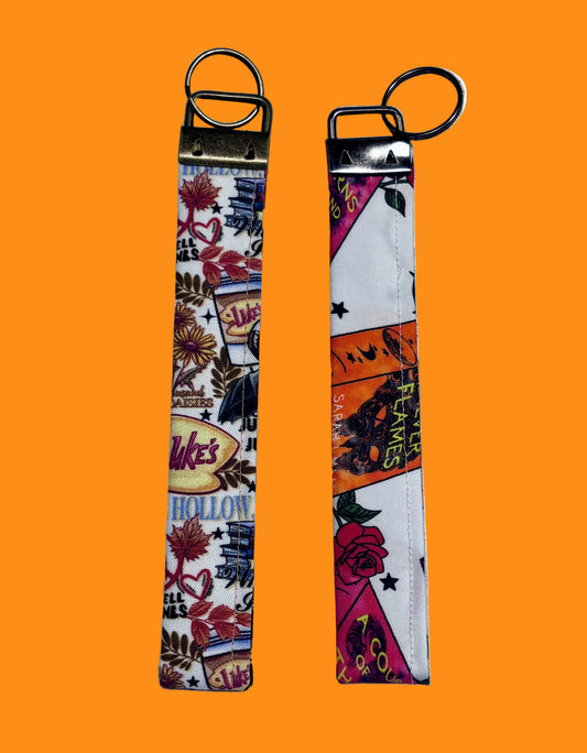 Handmade and ready to ship. Two keychains with colorful designs in Stars Hollow and ACO books.