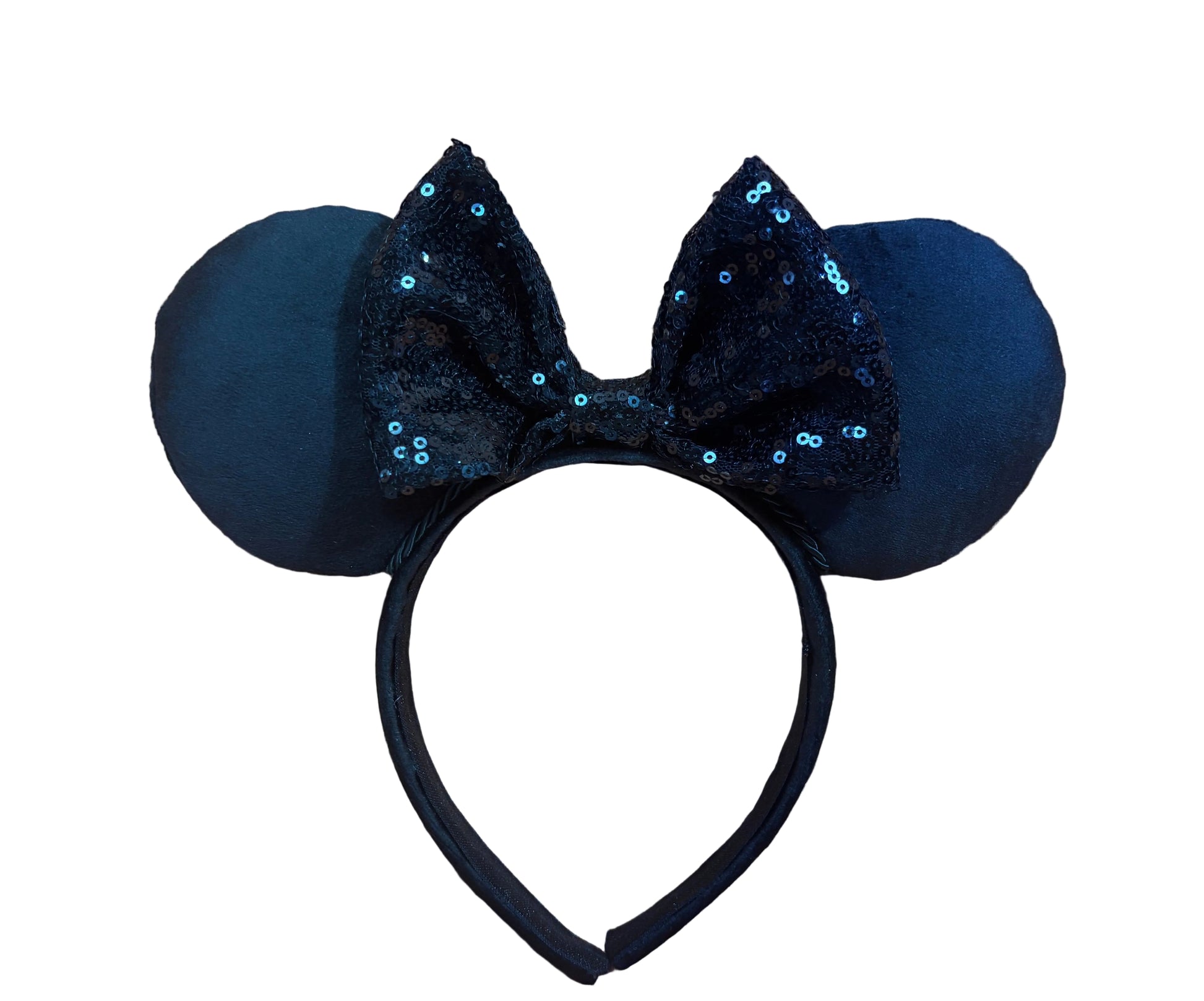 Black mouse ears with sequin bow on a beige background