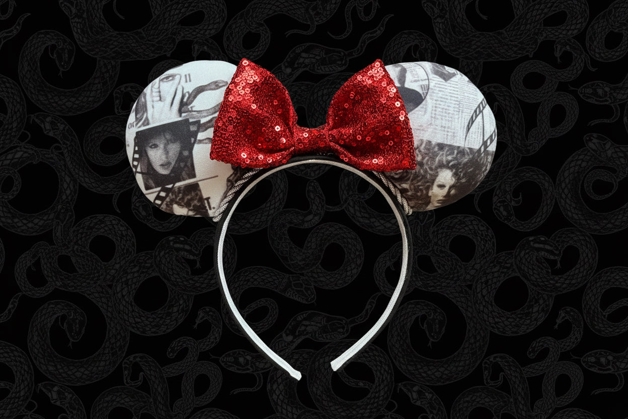 Mouse ears with a red bow on a black background
