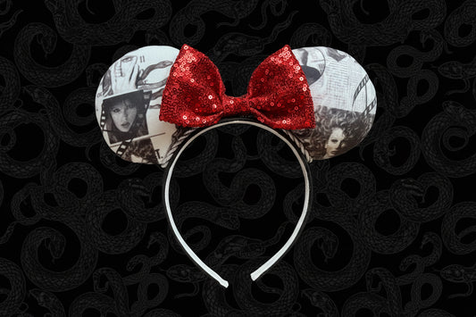 Mouse ears with a red bow on a black background