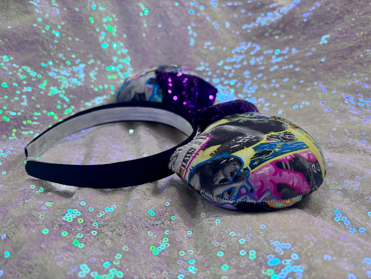 Handmade and ready to ship. Fabric images inspired by Tay and the fortnight video is on the front and back with a purple sequin bow. Shown on a white background.