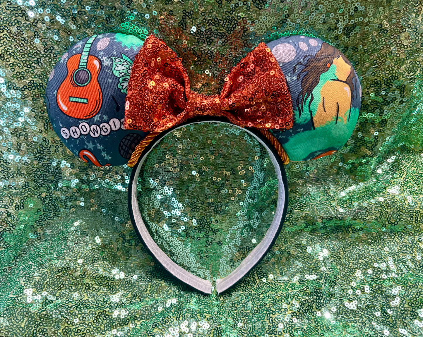 Handmade and ready to ship Actually Romantic Mouse ears with an orange sequin bow, orange twisted trim and on a black universal sized headband.