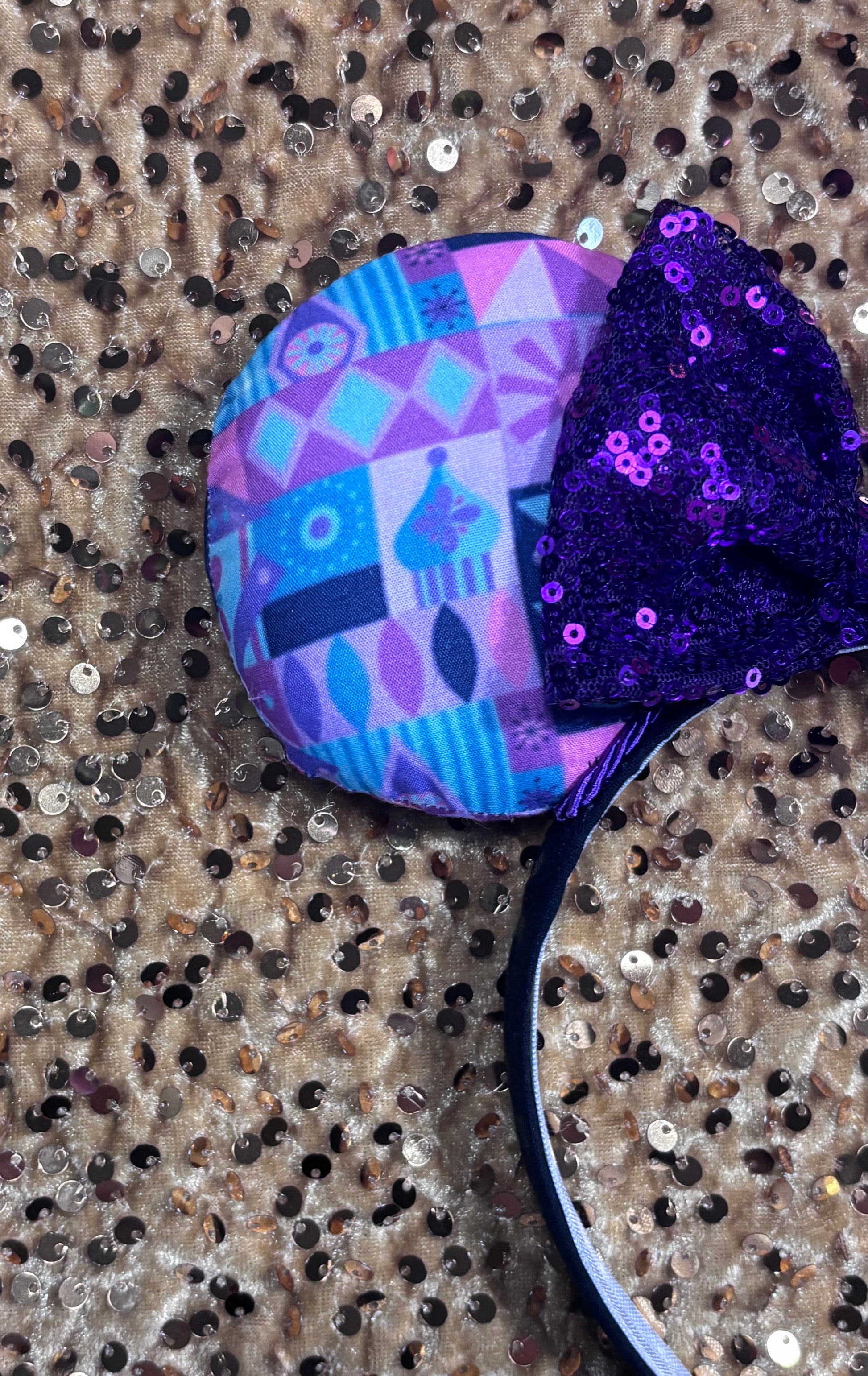 small world purple and pink mouse ear headband with a purple sequin bow