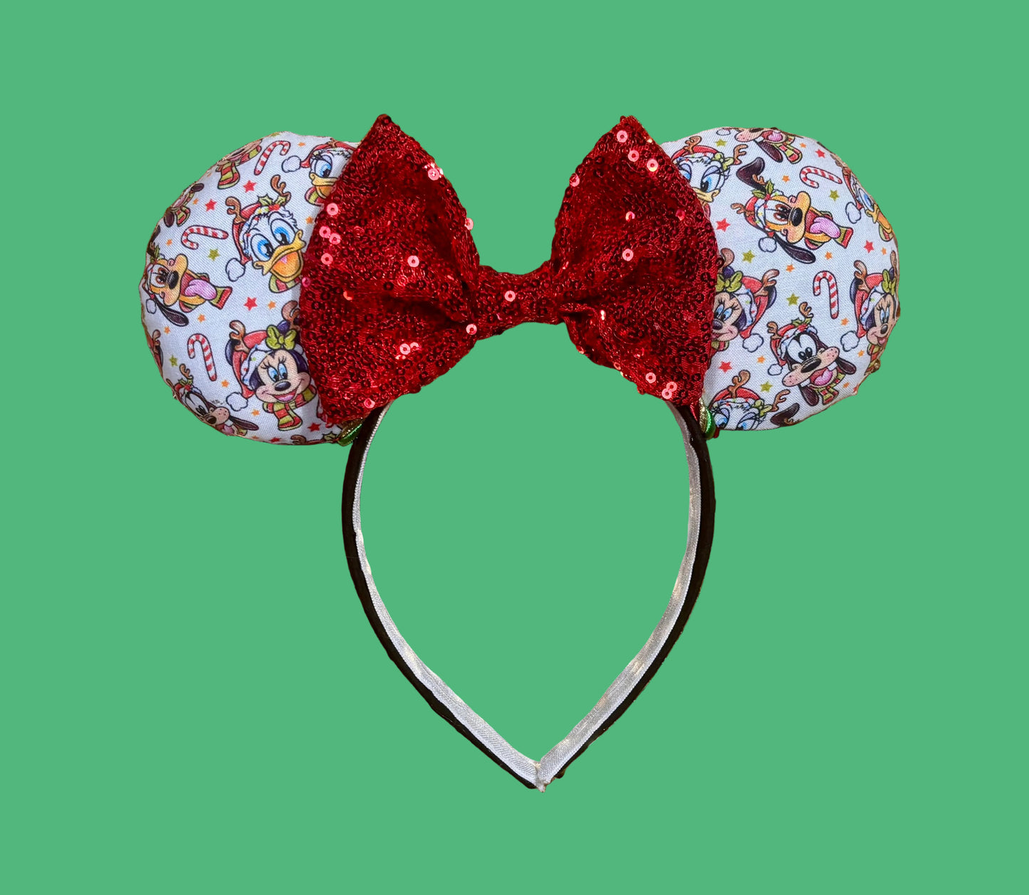 Handmade and ready to ship mouse ears. Mouse ears are on a universal sized poly cotton headband and set comes with a red sequin bow. Other colors are available if you leave a note.
