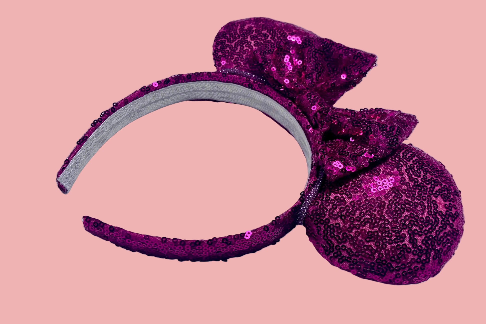 Handmade and ready to ship, Hot Pink Custom Ears. Fabric is on ears front and back with pink rhinestone trim along the inner ears and a matching hot pink sequin bow. The Headband is universal sized and has the same hot pink sequin fabric.