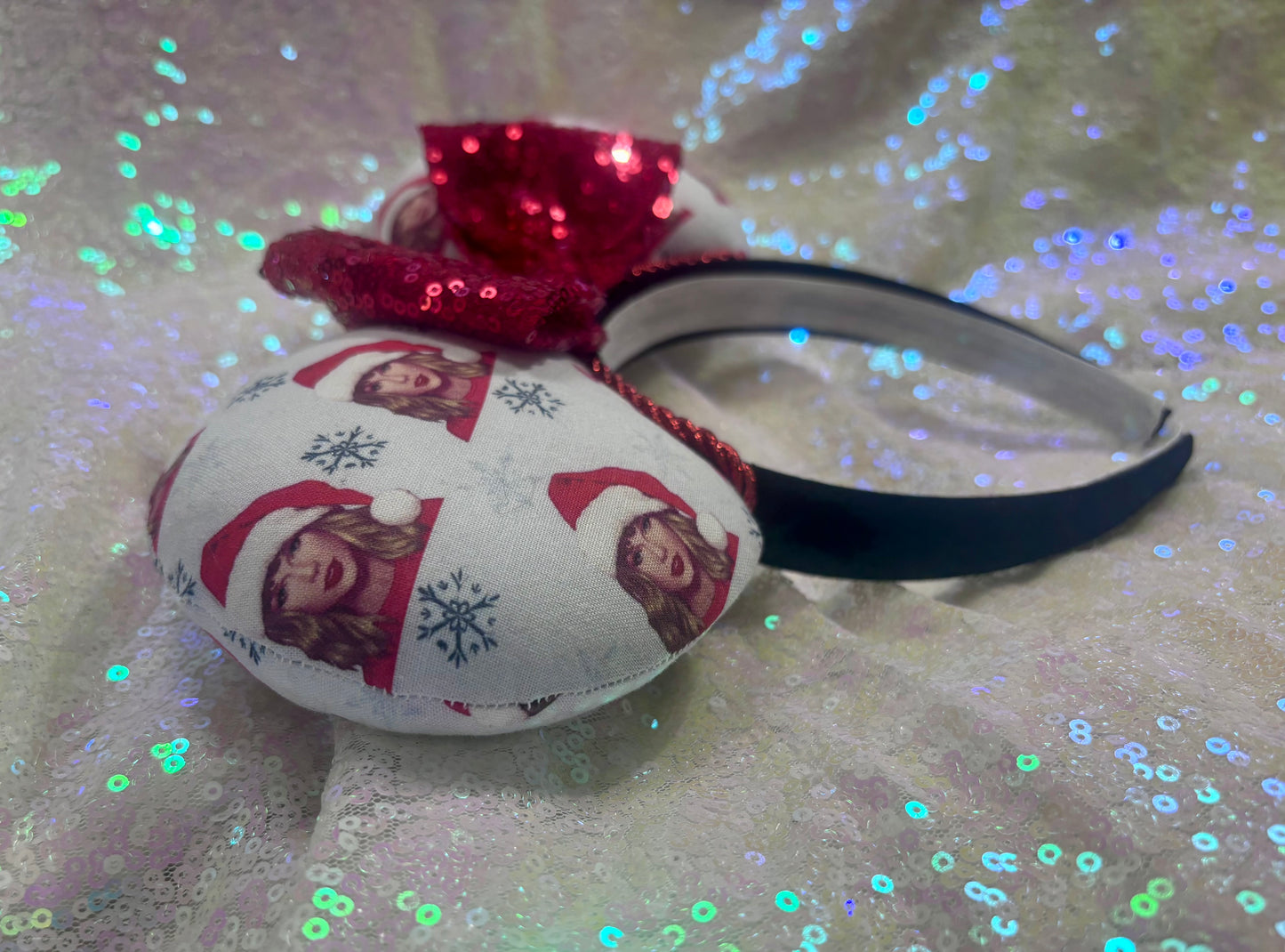 Decorative headband with festive design on a glittery background