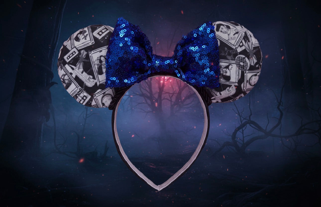 Mouse ear headband with blue bow and strangers things tarot collage pattern on a dark background