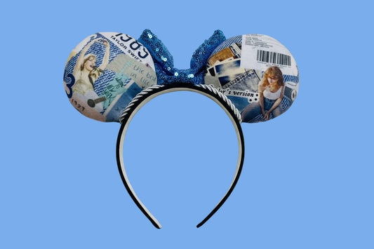 Mouse ear headband view from the back showing images of TS on both ears, the silver twisted trim and the headband.