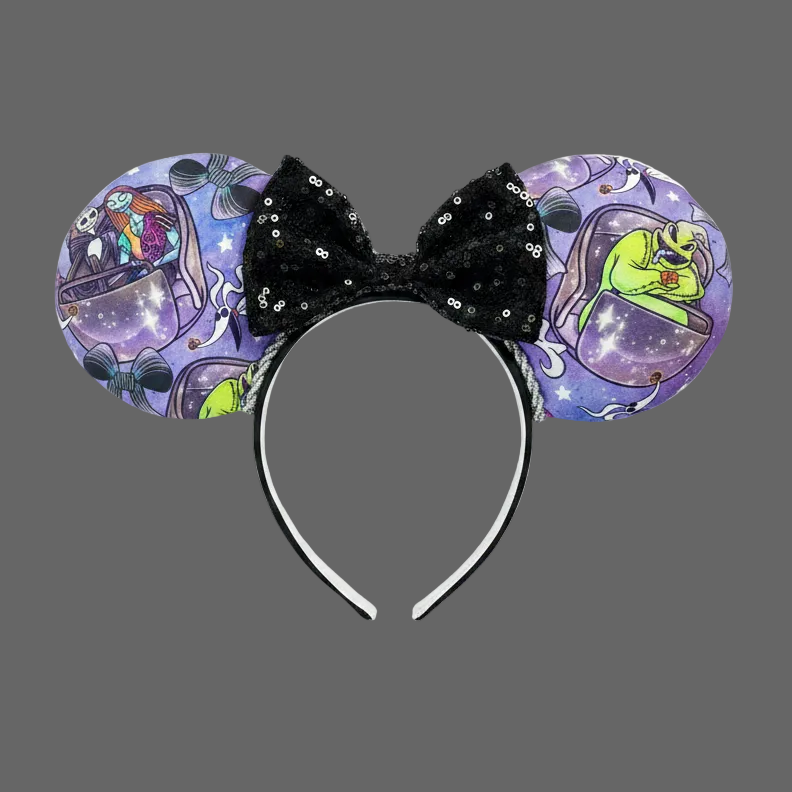 Handmade and ready to ship HM and NBC Mashup mouse ears. The fabric is on both the front and back. The headband is black and lined with white elastic. Shown with a black sequin bow.