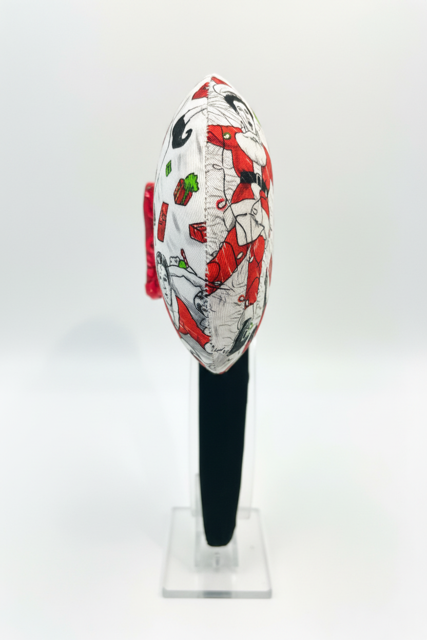 Classic Christmas films inspired fabric on front, back and the headband as well. These are handmade and ready to ship mouse ears with a red sequin bow. Shown on a white background. Side view of ears.