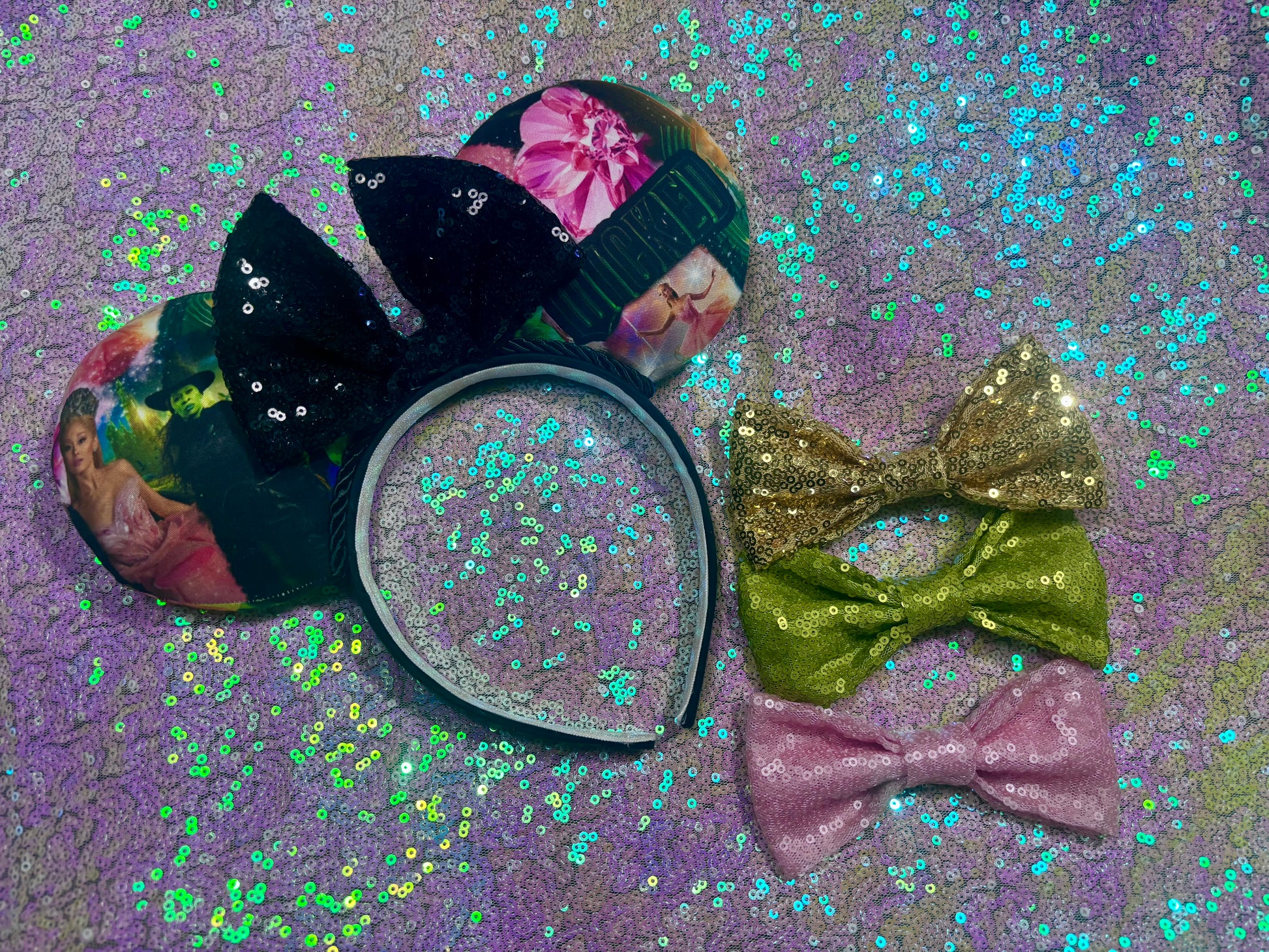 Collection of colorful hair bows on a glittery purple background