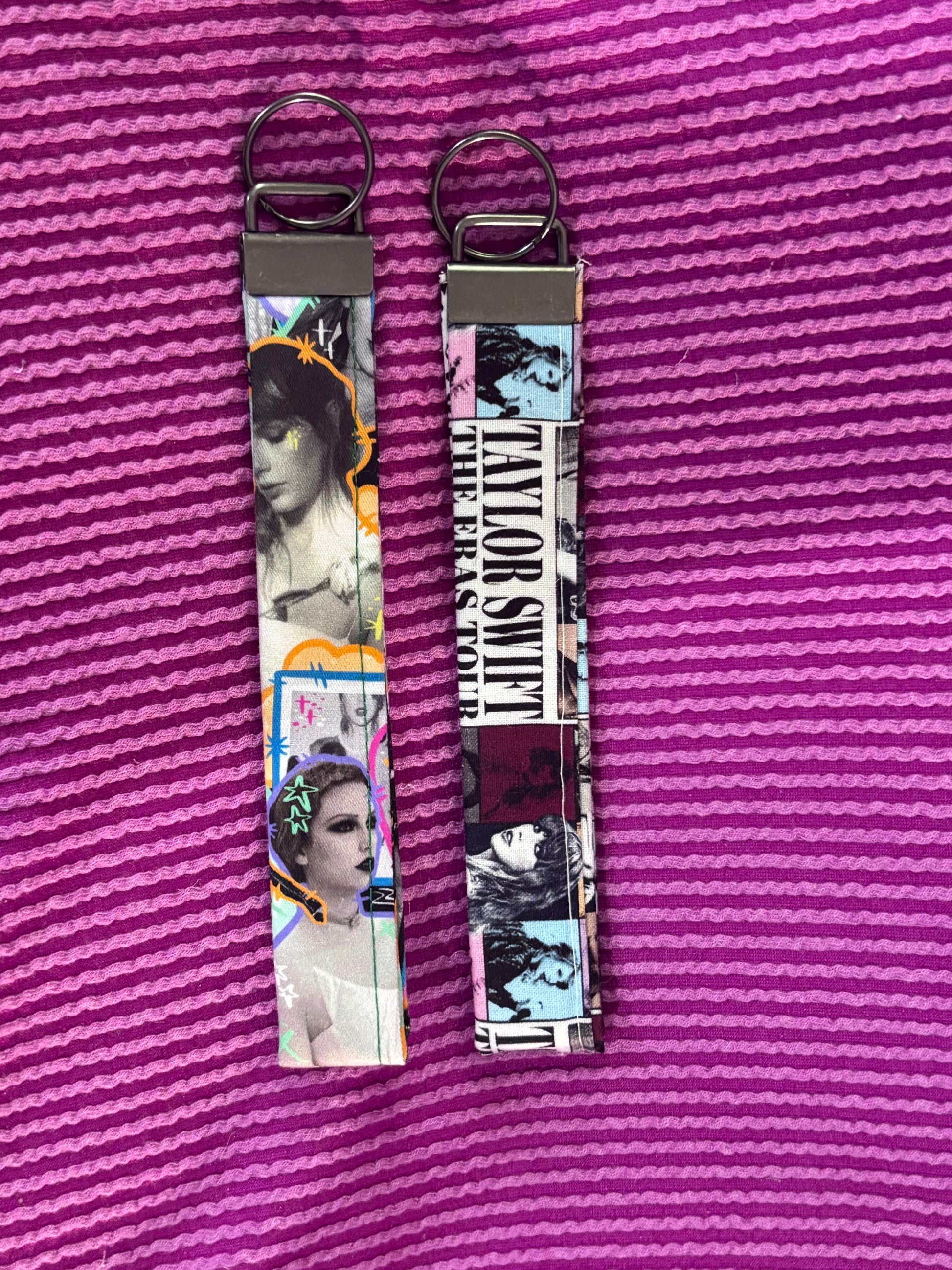 Two keychains with Swift images on a purple textured background