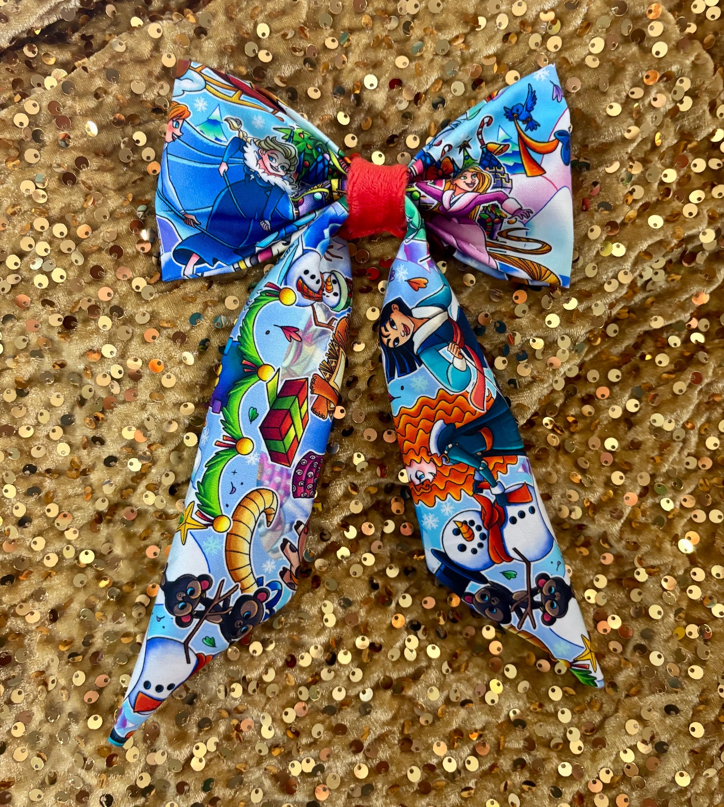 Close up of the Christmas princess toon characters on a gold sequin background