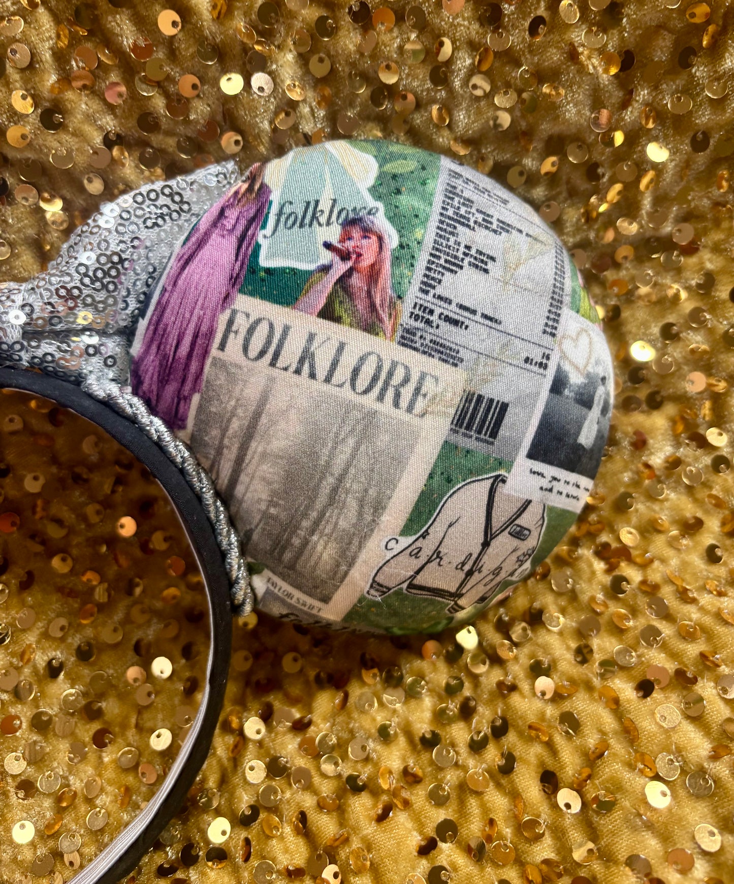 Back of mouse ears for a close up show of the design. Shown on a glittery gold background