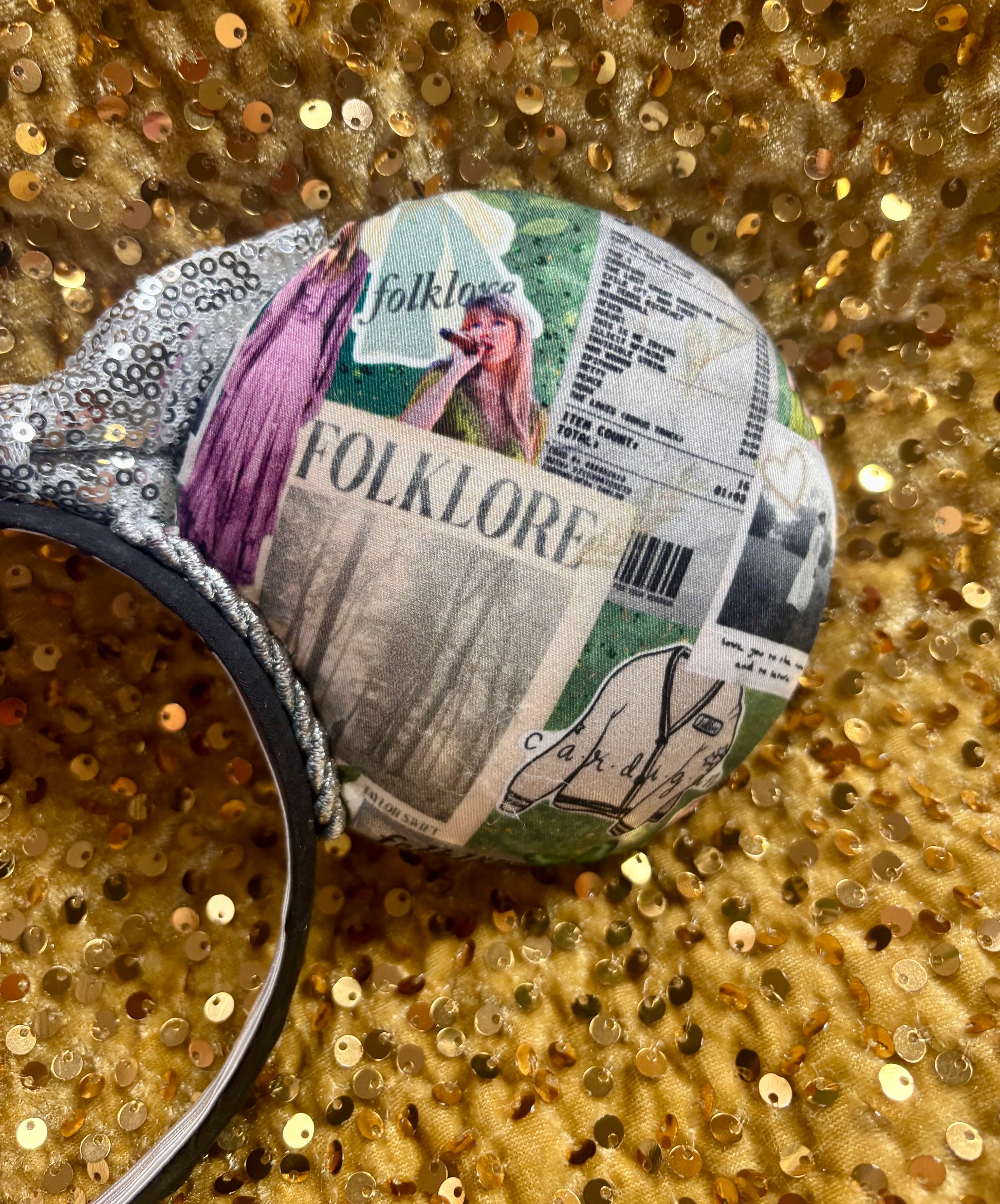 Back of mouse ears for a close up show of the design. Shown on a glittery gold background