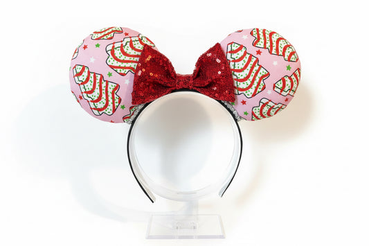 Decorative headband with Christmas tree cake snacks pattern and red center on a white background