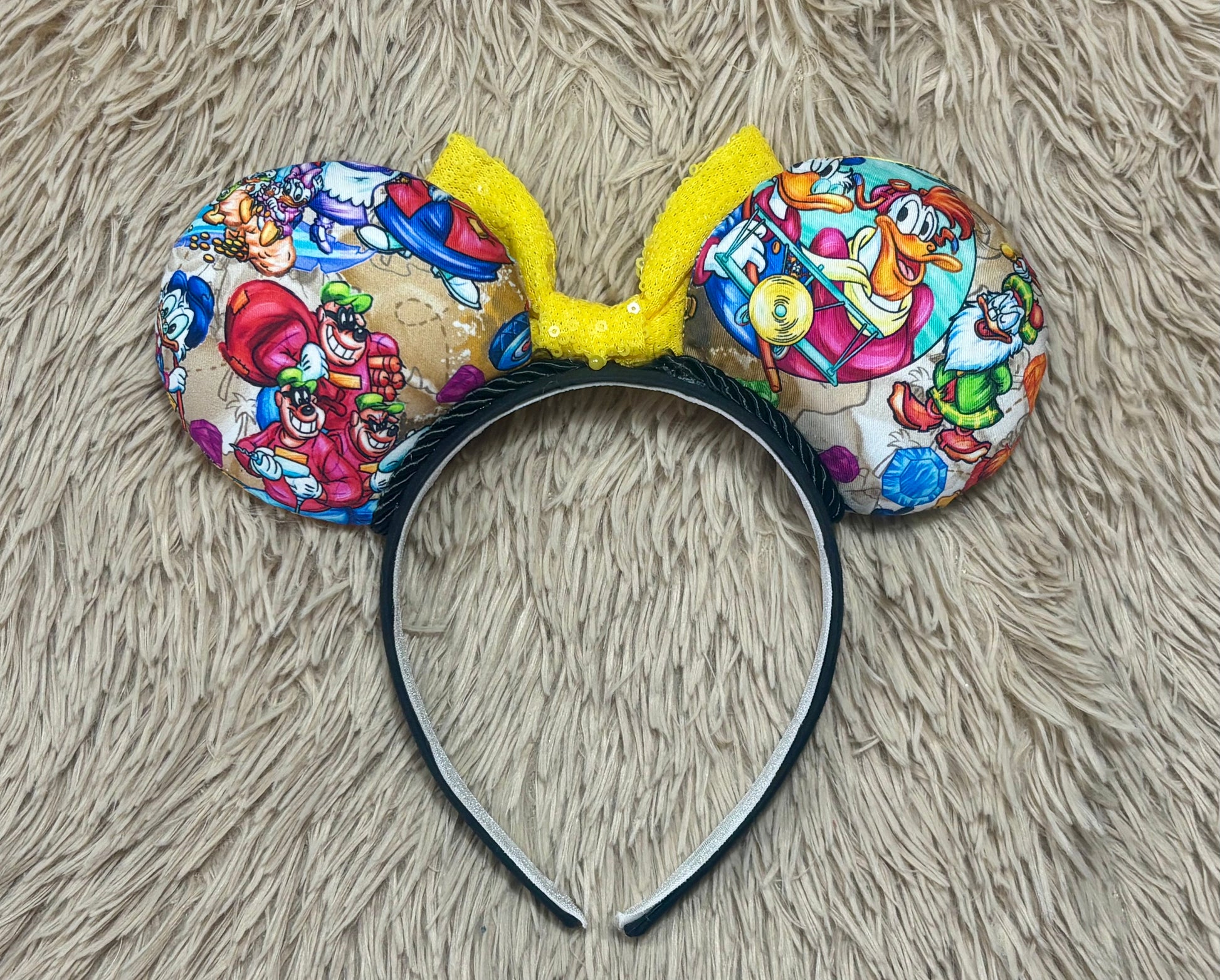 Back view of ears with various duck characters shown.