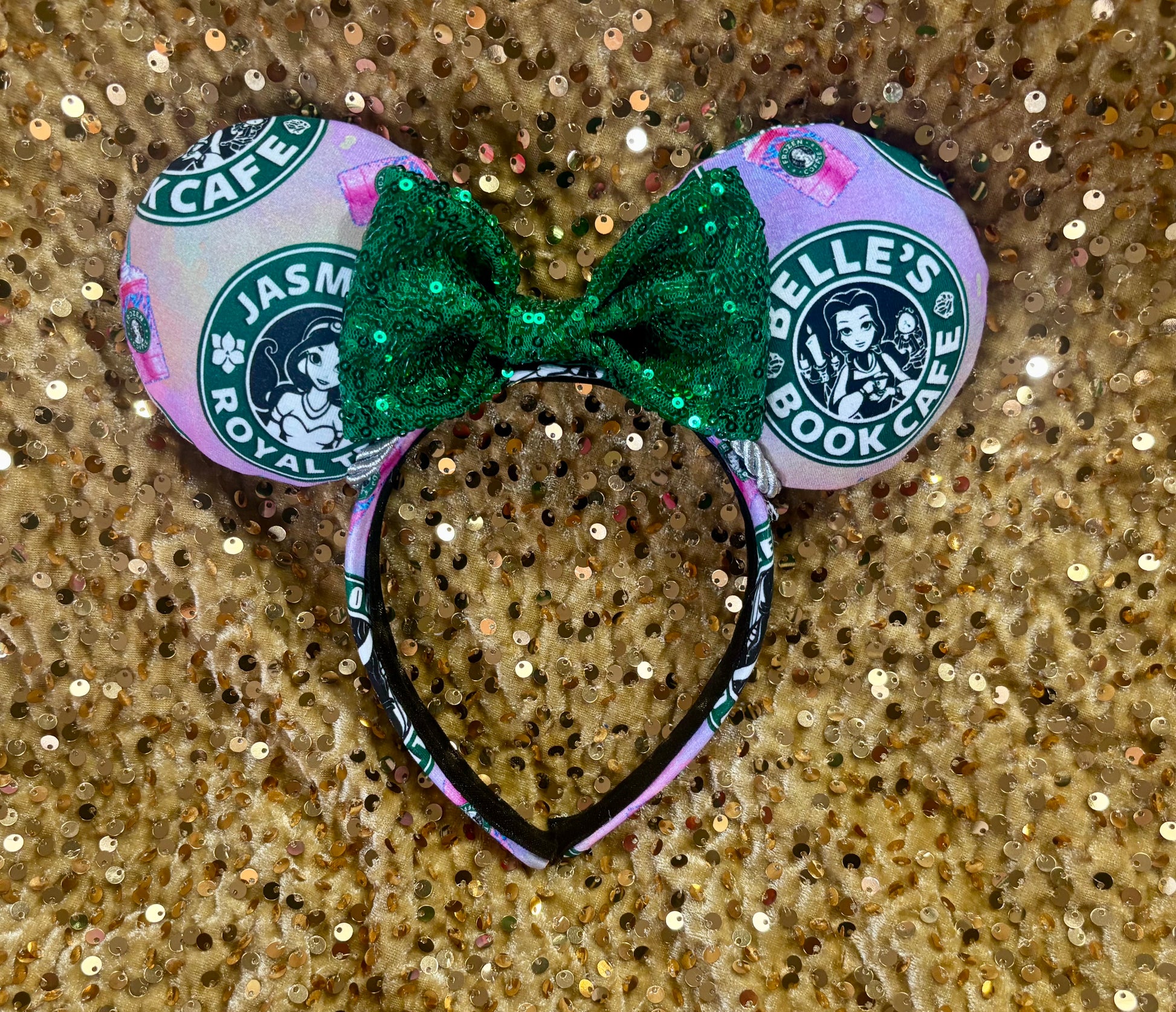 Handmade and ready to ship custom ears with popular coffee themed with princesses on fabric. Green sequin bow and silver twisted trim on a universal sized headband with matching design as the mouse ears.