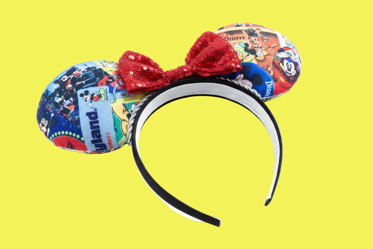 Handmade and ready to ship custom and unique ears that have cartoon and park images on them on the front and back of the ears. Silver twisted trim is along the inner ears with a red sequin bow on a black poly cotton universal sized headband.