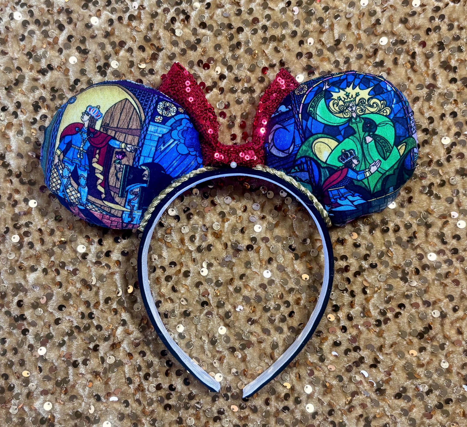 Back view of mouse ears and the prince and the enchantress on them.